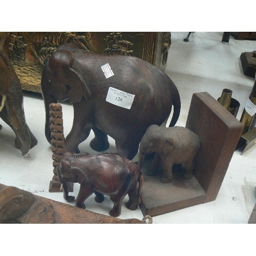 126 - WOODEN ELEPHANT COLLECTION. VINTAGE. INCLUDES 2 LARGE CARVED, 1 SMALLER, 1 BOOKEND, TINY CARVED ELEP... 