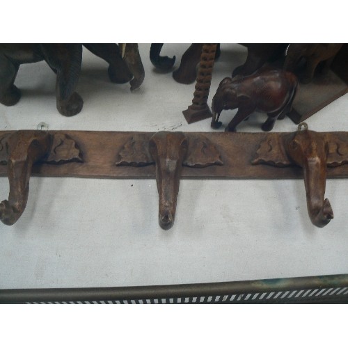 126 - WOODEN ELEPHANT COLLECTION. VINTAGE. INCLUDES 2 LARGE CARVED, 1 SMALLER, 1 BOOKEND, TINY CARVED ELEP... 