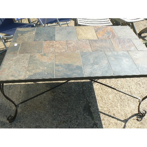 571 - HEAV TILE TOPPED METAL OUTDOOR TABLE ON CAST IROM LEGS