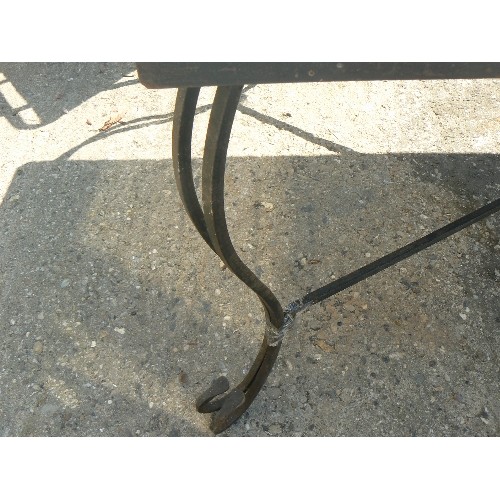 571 - HEAV TILE TOPPED METAL OUTDOOR TABLE ON CAST IROM LEGS