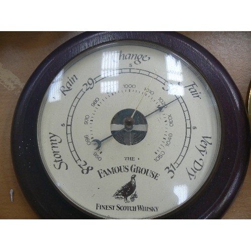 447 - FAMOUS GROUSE SCOTCH WHISKEY BRANDED BAROMETER. ALSO A BRASS FRAMED MONARCH WALL CLOCK.