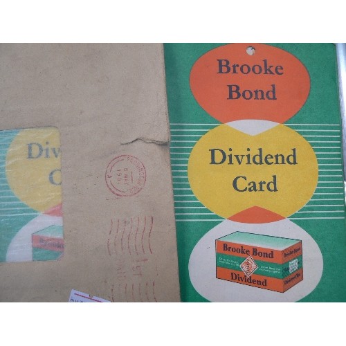 448 - STAMP STOCK BOOK CONTAINING SOME STAMPS, LOOSE STAMPS, VINTAGE BROOKE BOND DIVIDEND STAMPS AND CARDS... 