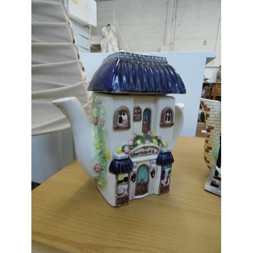 560 - THE VILLAGE-TEAPOT COLLECTABLES 'THE CHEMIST SHOP' ALSO A TEAPOT ANTIQUE SHOP.
