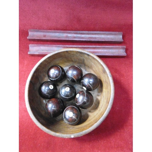 72 - SET OF VICTORIAN CARPET BOWLS CONTAINED IN A WOODEN BOWL WITH WOODEN HOLDERS