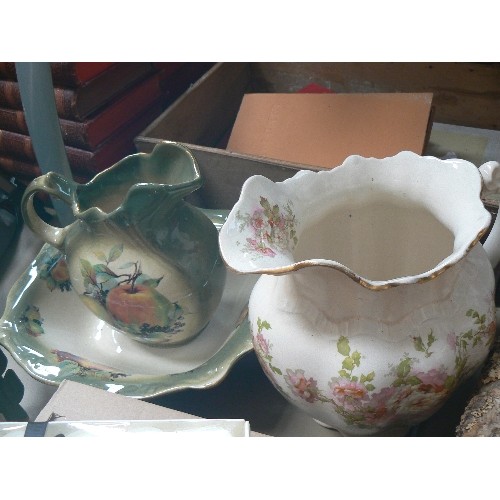 252 - JUG AND BOWL SET IN DARK GREEN WITH FRUIT DETAIL, AND A LARGE CREAM WASH JUG WITH PRETTY FLOWERS.