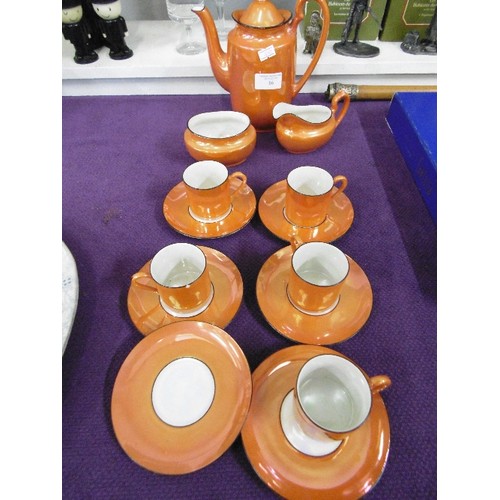 86 - VIBRANT ORANGE PORLITHY LUSTREWARE COFFEE SET. MISSING 1 CUP, 1 HAS A NIBBLE.