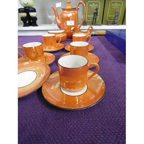 86 - VIBRANT ORANGE PORLITHY LUSTREWARE COFFEE SET. MISSING 1 CUP, 1 HAS A NIBBLE.