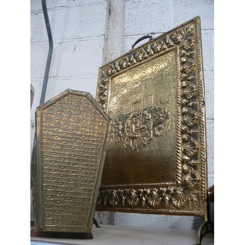 290 - VINTAGE EMBOSSED BRASS FIRE SCREEN AND MAGAZINE RACK. SCREEN FEATURING MEN PLAYING CARDS OUTSIDE A T... 