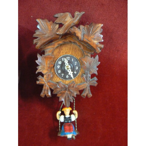 93 - 2 X CUCKOO CLOCKS, INC A SWISS CHALET, & A SMALLER CLOCK WITH TRADITIONAL FIGURES ON SWINGS HANGING ... 