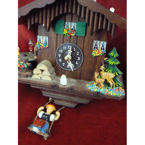 93 - 2 X CUCKOO CLOCKS, INC A SWISS CHALET, & A SMALLER CLOCK WITH TRADITIONAL FIGURES ON SWINGS HANGING ... 