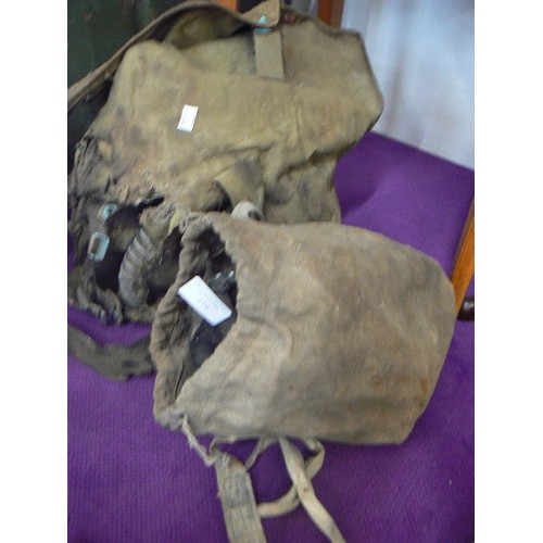 119 - WWII GAS MASKS IN CANVAS BAGS.