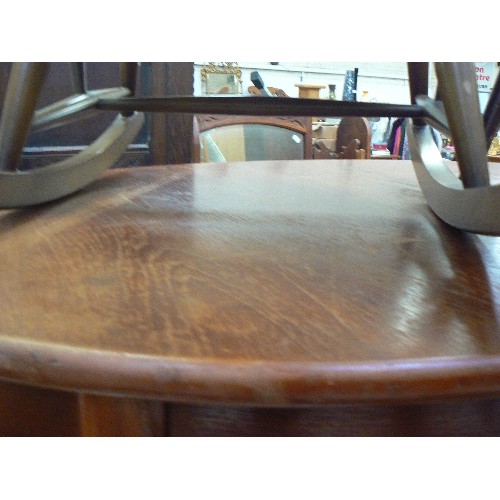 429 - TEAK EXTENDING DINING TABLE. OVAL. TAPERED LEGS.