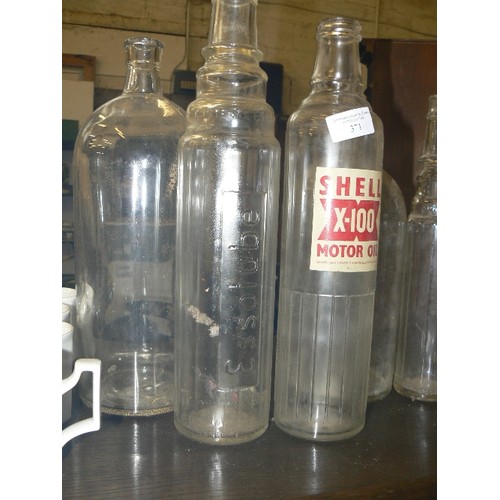 371 - 6 X LARGE VINTAGE GLASS BOTTLES, INC ESSOLUBE & SHELL X-100 MOTOR OIL.