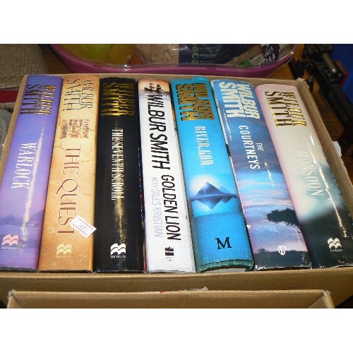 393 - 2 BOXES OF LARGE SIZE WILBUR SMITH HARDBACKS. 20+. APPEAR GOOD CONDITION WITH DUST COVERS.