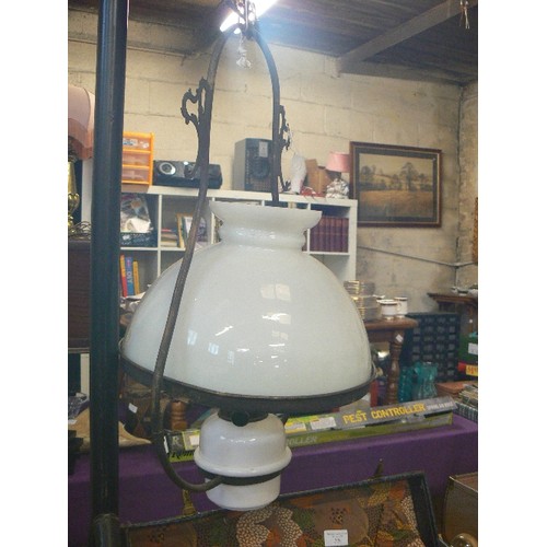 227 - HANGING OIL LAMP. MILK GLASS SHADE AND RESERVOIR, WROUGHT IRON FRAME.