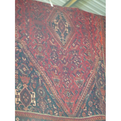 340 - LARGE IRANIAN HAND-KNOTTED RUG. 255 X 176. APPEARS IN GOOD CONDITION. RED PATTERNED.