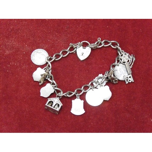 15 - SILVER HALLMARKED BRACELET WITH SILVER CHARMS, THREEPENCE COINS, ETC