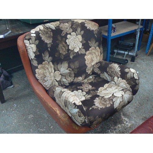 539 - VERY LARGE RETRO-VINTAGE ORANGE LEATHERETTE ARMCHAIR. CUSHIONS HAVE BEEN COVERED IN BROWN FLORAL FAB... 