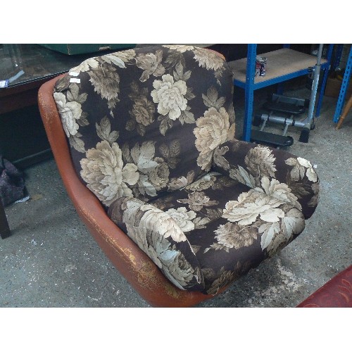 539 - VERY LARGE RETRO-VINTAGE ORANGE LEATHERETTE ARMCHAIR. CUSHIONS HAVE BEEN COVERED IN BROWN FLORAL FAB... 