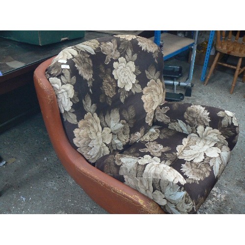 539 - VERY LARGE RETRO-VINTAGE ORANGE LEATHERETTE ARMCHAIR. CUSHIONS HAVE BEEN COVERED IN BROWN FLORAL FAB... 