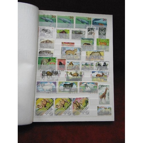 94 - 4 X STAMP STOCK BOOK ALBUMS. WITH CONTENTS. SPAIN, BELGIUM, ANIMALS, FISH, AND THAILAND.