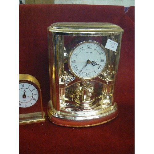 186 - A LARGE AND A SMALL QUARTZ CARRIAGE CLOCK. BRASS EFFECT.