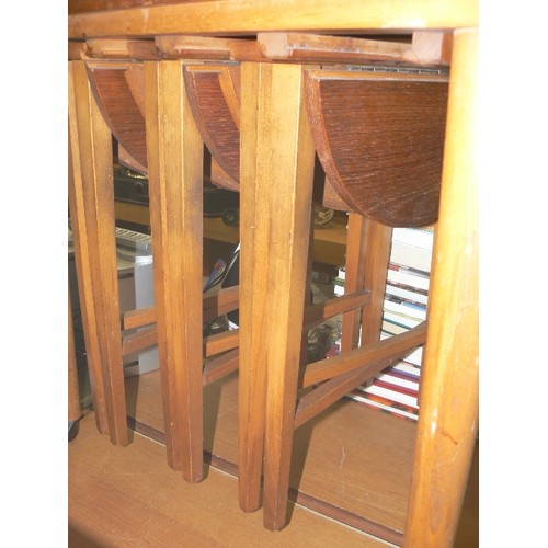 262 - CLEVER SET OF 4 RETRO-VINTAGE ROUND DROP-LEAF SIDE TABLES, CONTAINED IN ANOTHER TABLE ON CASTORS.