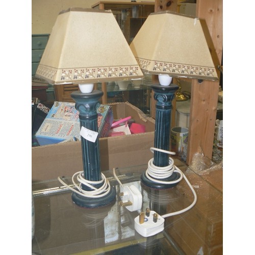 296 - PAIR OF SMALL TABLE LAMPS WITH DARK GREEN COLUMN BASES, AND CREAM PAPER SHADES.