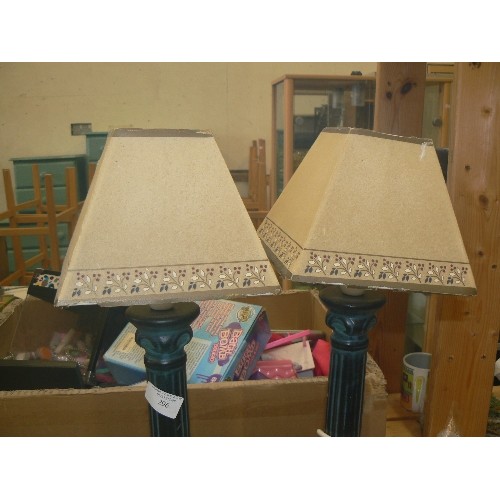 296 - PAIR OF SMALL TABLE LAMPS WITH DARK GREEN COLUMN BASES, AND CREAM PAPER SHADES.