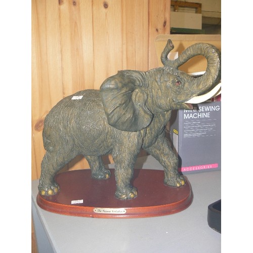 307 - LARGE ELEPHANT FIGURE ON WOODEN BASE. FROM THE JULIANA COLLECTION. RESIN. APPEARS IN GOOD COND.