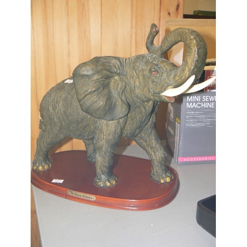 307 - LARGE ELEPHANT FIGURE ON WOODEN BASE. FROM THE JULIANA COLLECTION. RESIN. APPEARS IN GOOD COND.