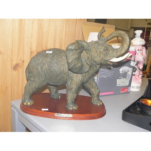 307 - LARGE ELEPHANT FIGURE ON WOODEN BASE. FROM THE JULIANA COLLECTION. RESIN. APPEARS IN GOOD COND.