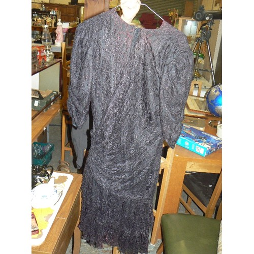 141 - VINTAGE 1970'S FRANK USHER DRESS, BLACK LACE WITH RUCHED SIDE DETAIL & LAYERED SKIRT. SIZE 10.