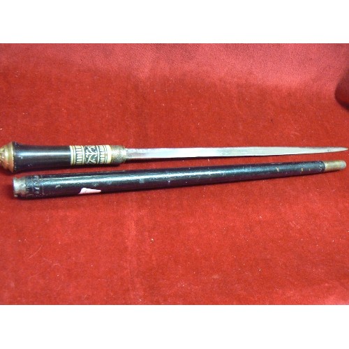 17 - A SWAGGER STICK WHICH IS A SWORD STICK MADE IN INDIA WITH BONE COLLAR AND BRASS ENDS