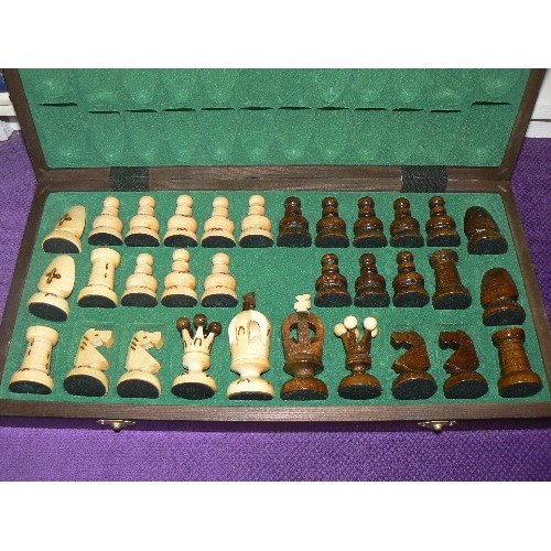 87 - WOODEN CHESS SET. THE BOX OPENS UP TO FORM THE CHESS BOARD.