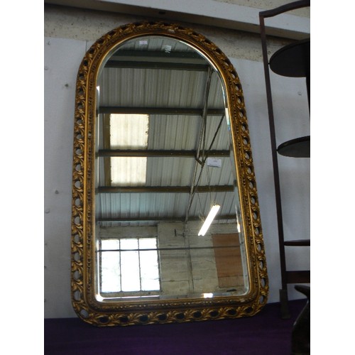 100 - GILT FRAMED WALL MIRROR WITH ARCHED TOP.