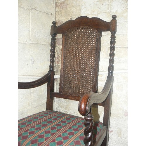 159 - 1920'S JACOBEAN STYLE OAK ARMCHAIR, WITH BARLEY TWIST TURNING, AND CANEWORK BACK PANEL.