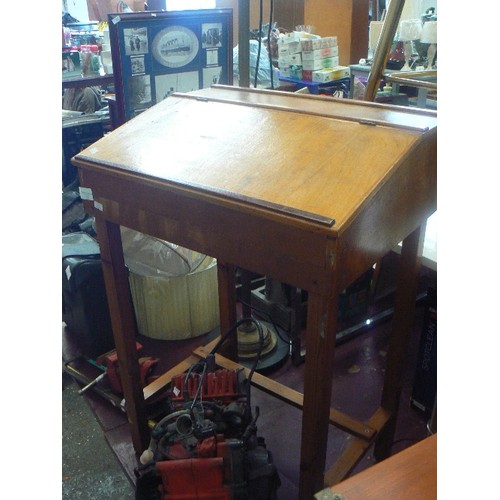 222 - CHILDS DESK WITH INGED LID. PLYWOOD, AND ON PINE LEGS.