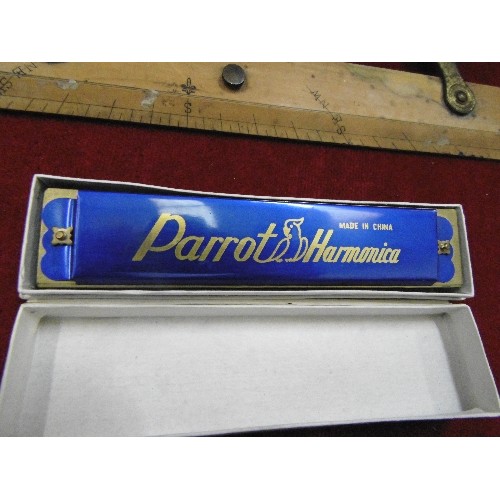 290 - A VINTAGE PARROT HARMONICA, A WOODEN EXPANDING RULER, AND A COLLECTION OF LEATHER WALLETS.