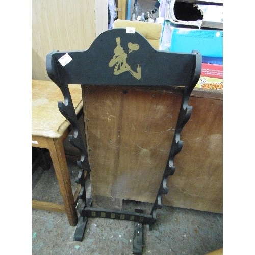 297 - MARTIAL ARTS SWORD/WEAPON RACK. FREE-STANDING, HOLDS 6 PCS. BLACK WITH GOLD CHINESE DESIGN. NEEDS SL... 