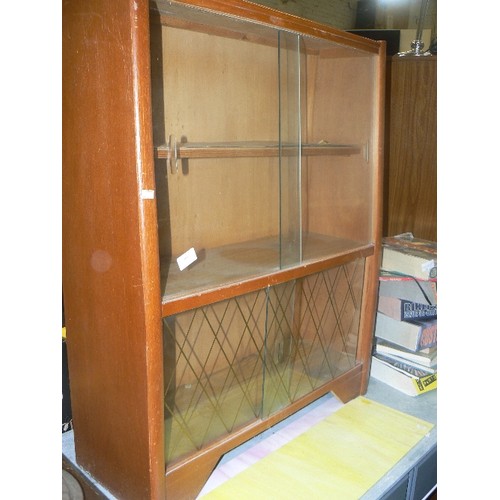 363 - RETRO-VINTAGE TEAK DISPLAY CABINET. GLASS SLIDING DOORS. DIAMOND DETAIL ON BOTTOM DOORS.