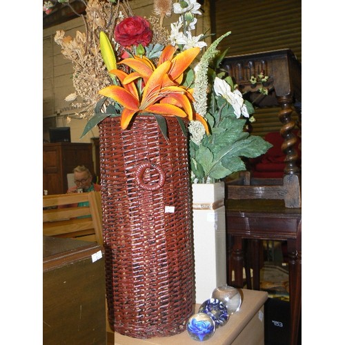 496 - QUANTITY OF SILK AND FAUX FLOWERS CONTAINED IN A TALL BASKET, AND A TALL VASE.