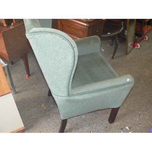 379 - SAGE GREEN DRALON WING-BACK CHAIR. APPEARS GOOD CONDITION.