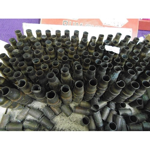 121 - BELT OF MACHINE GUN SHELL CASES. AND LARGE QUANTITY OF 9ML REVOLVER SHELL CASES. IN A REY-WEST SWEET... 