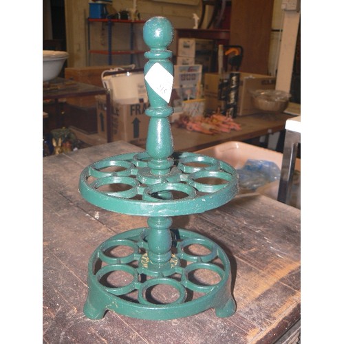 215 - CAST IRON TRIVET, EGG RACK, BOX OF DOUBLE-ENDED NAILS, ALL CONTAINED IN A VINTAGE WIRE BASKET.