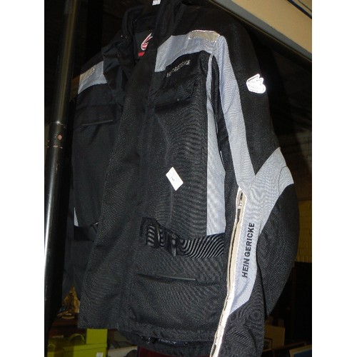 188 - HEIN GERICKE MOTORCYCLE JACKET. SIZE M. APPEARS GOOD CONDITION. BLACK WITH GREY DETAIING. PADDED INN... 