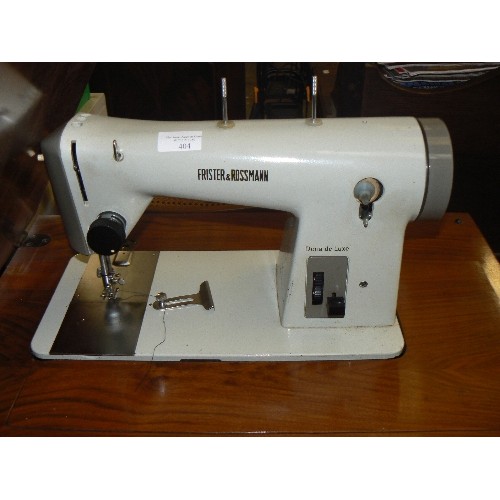 404 - FRISTER & ROSSMANN DORIA DELUXE SEWING MACHINE, ON SEWING TABLE WITH CABRIOLE LEGS. AMERICAN WALNUT ... 