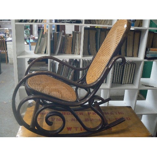 463 - VINTAGE BENTWOOD ROCKING CHAIR WITH RATTAN SEAT & BACK.