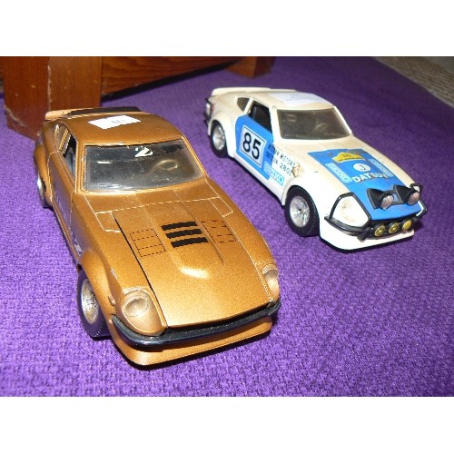 157 - 2 X BURAGO MODEL DATSUN CARS.