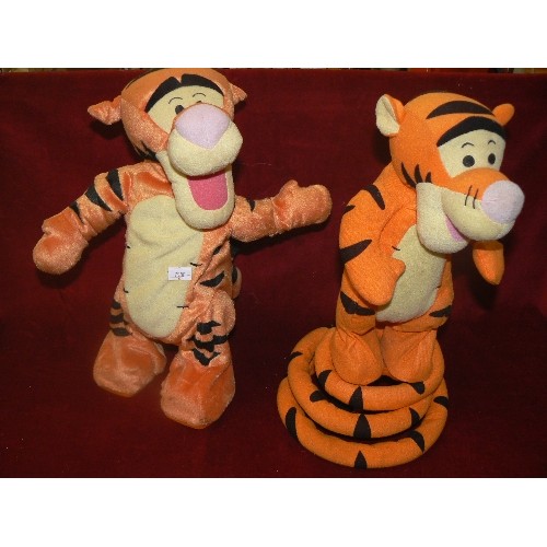 108 - 2 X VINTAGE TIGGERS. BOUNCING MECHANICAL TOYS. WE ARE TOLD THESE ARE WORKING.